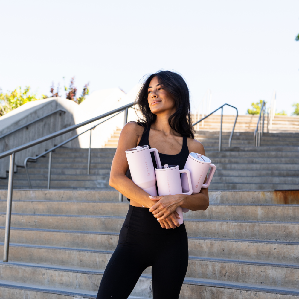 Woman Holding Tradeons Pink Sand Travelers
