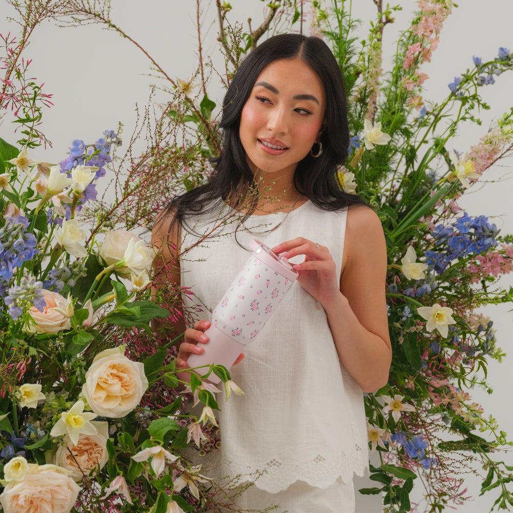 Woman Holding Tradeons Wildrose Sport Bottle 20oz