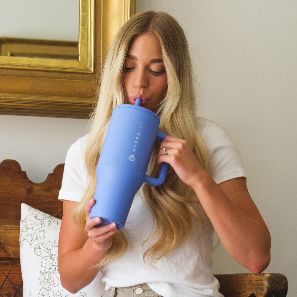Woman Drinking from Tradeons Light Blue Traveler 40oz