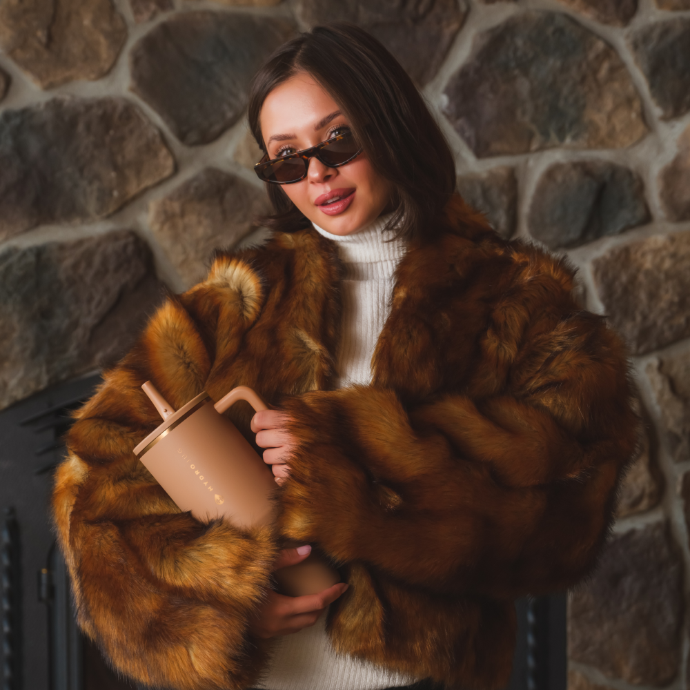 Woman Holding Tradeons Caramel Traveler 40oz