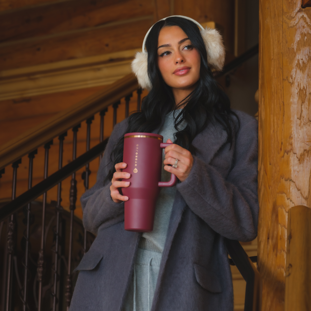 Woman Holding Tradeons Merlot Traveler 40oz