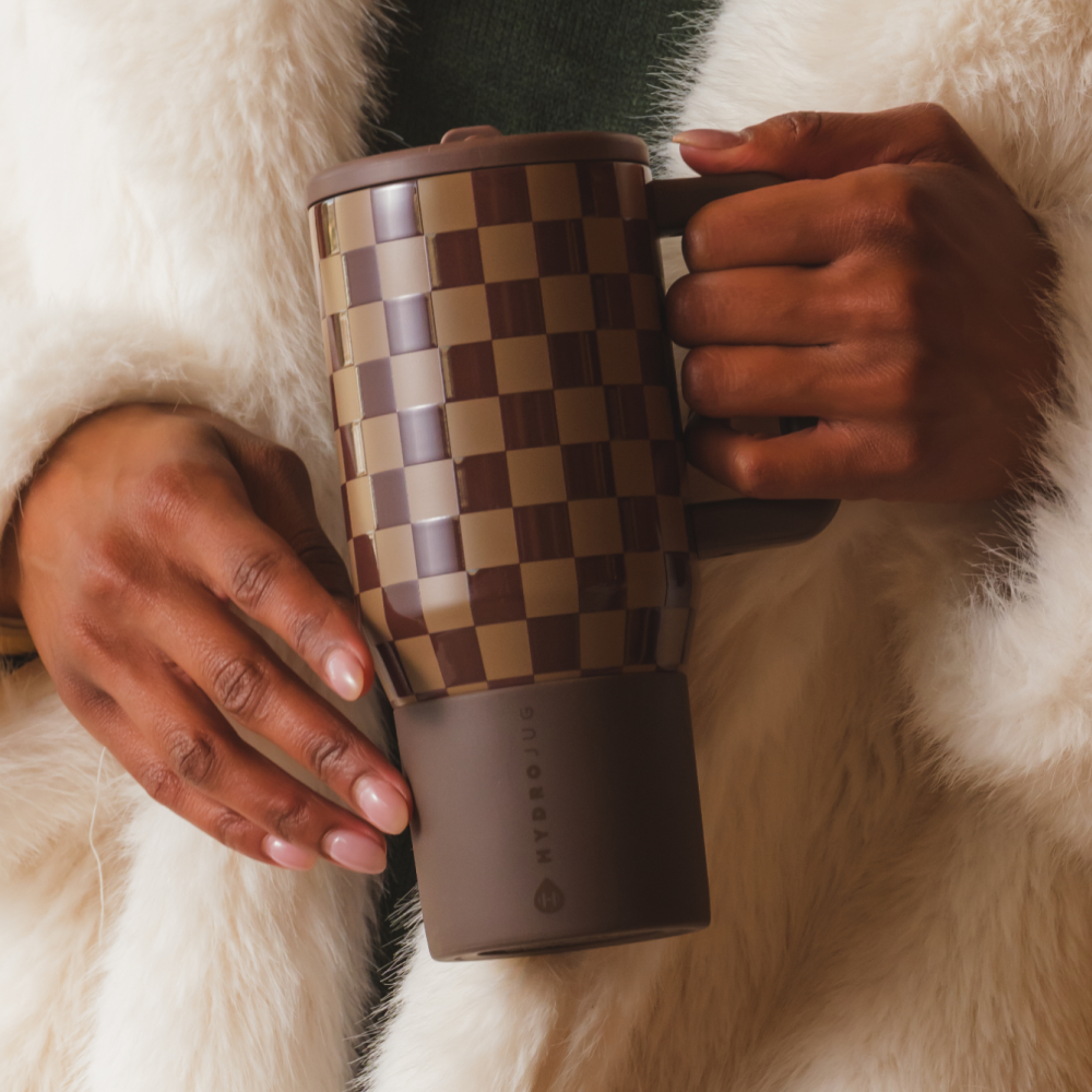 Person Holding Autumn Checkers Traveler 20oz